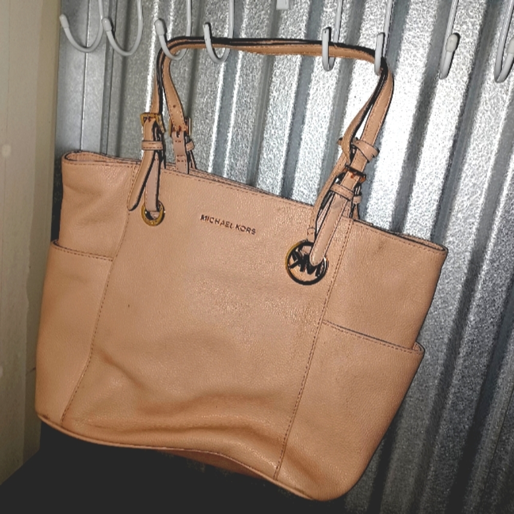 Michael Kors purse large light pink lightly used with tags still on it